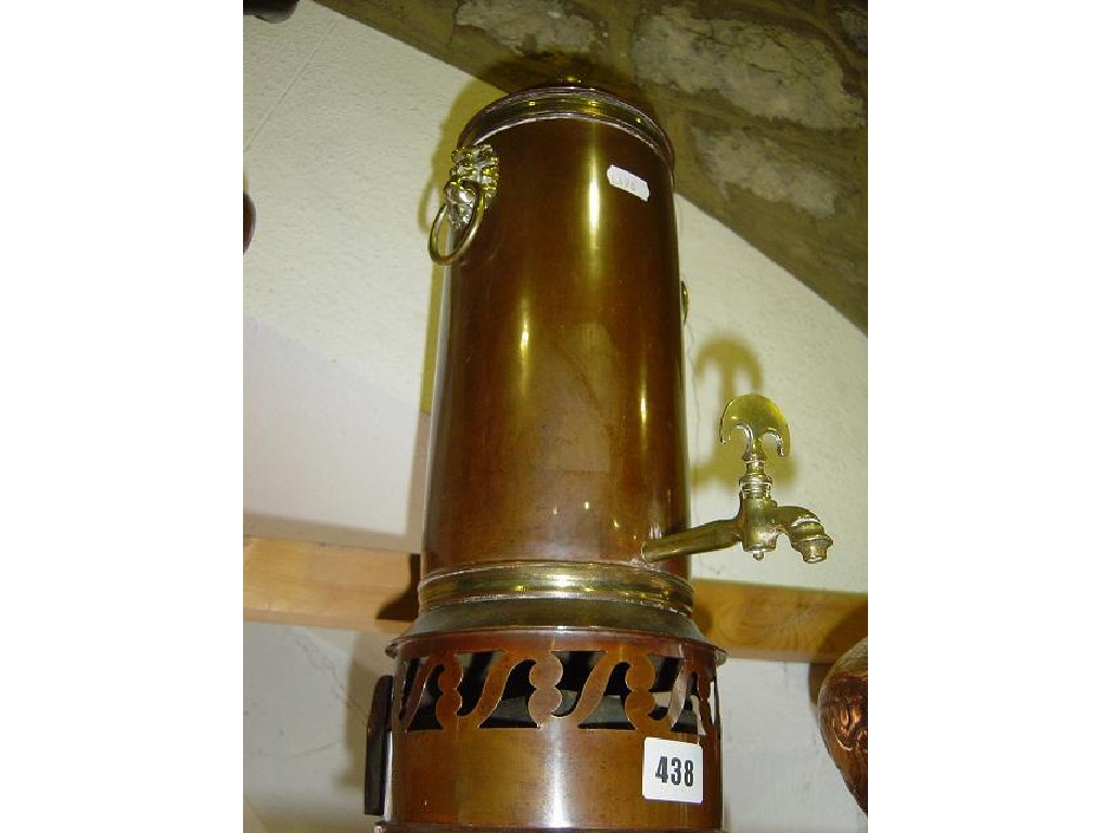 Appraisal: A tall copper samovar with brass tap and brass lion