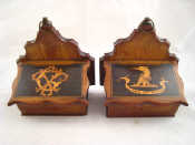 Appraisal: A pair of wall vestas one inlaid with a crest