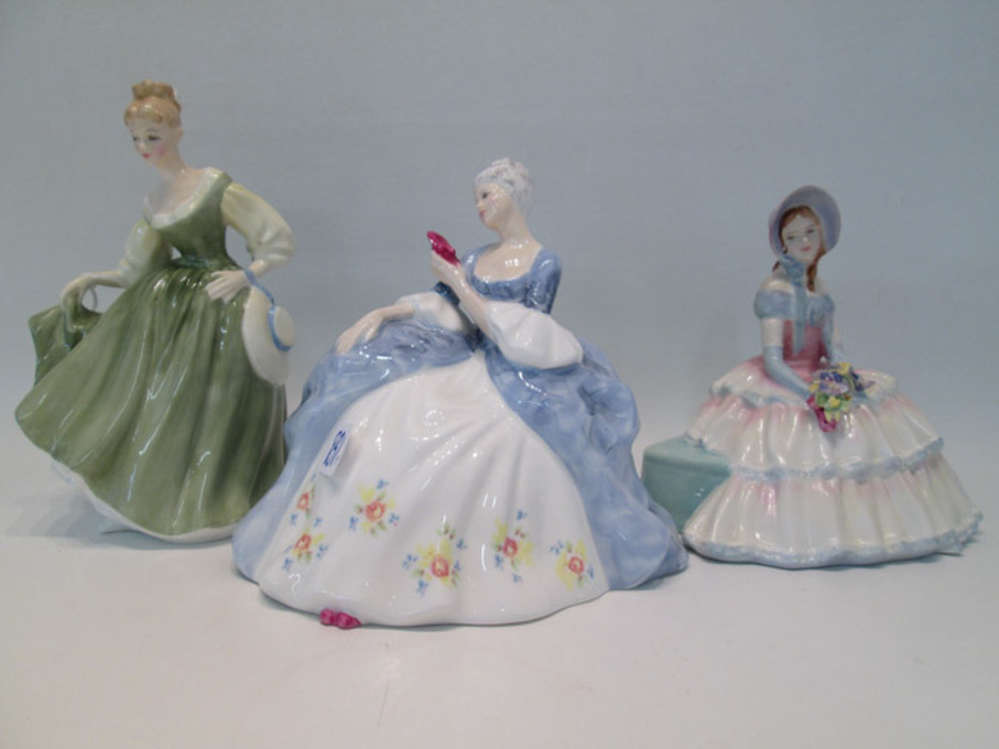 Appraisal: THREE ROYAL DOULTON PORCELAIN FIGURINES Wistful HN Fair Lady HN