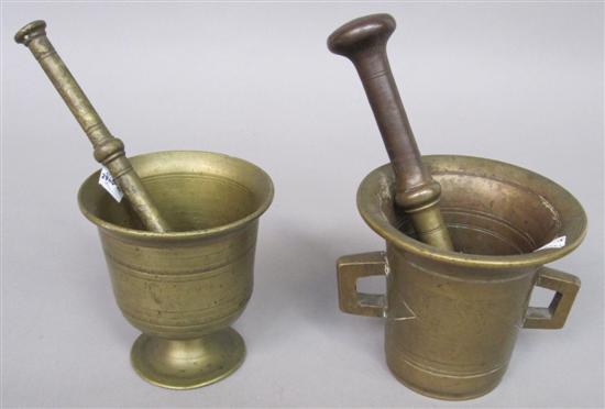 Appraisal: TWO ANTIQUE BRONZE MORTAR AND PESTLES One having handles Height