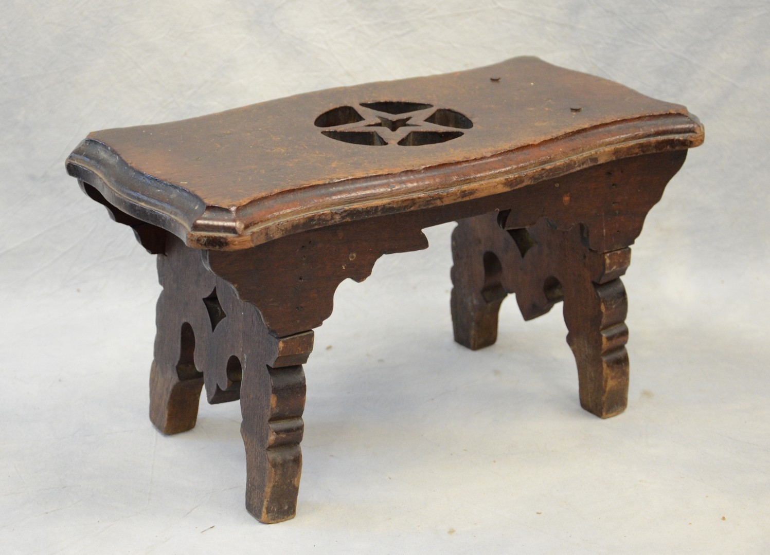 Appraisal: Splayed Walnut Architectural Stool with pierced diamond splayed legs and