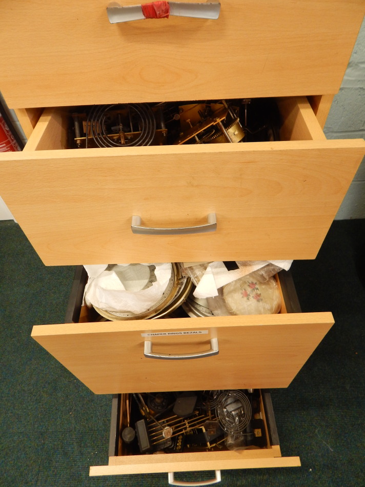 Appraisal: A filing cabinet containing various books on clocks DVD's brass