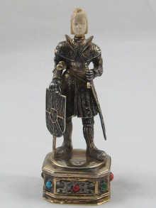 Appraisal: A silver figure of a knight with ivory head standing