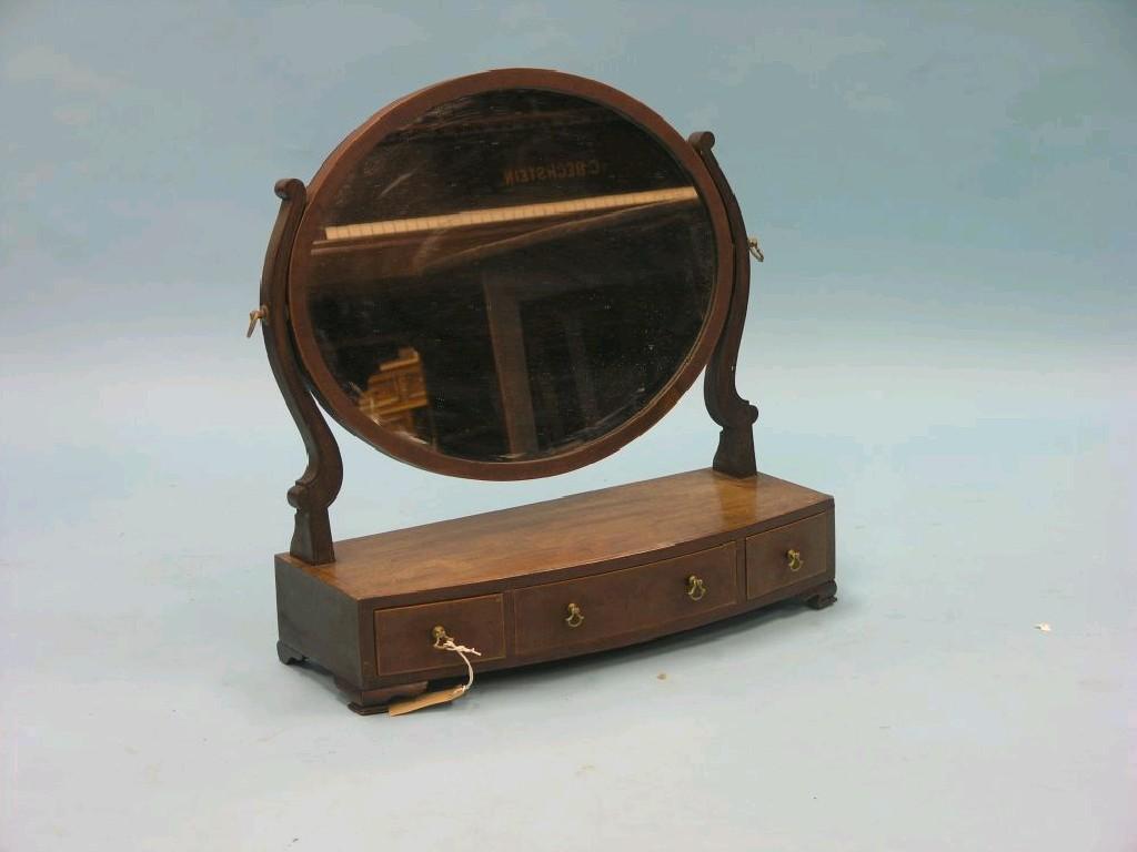 Appraisal: A Victorian mahogany toilet mirror oval mirror adjustable on bow-fronted