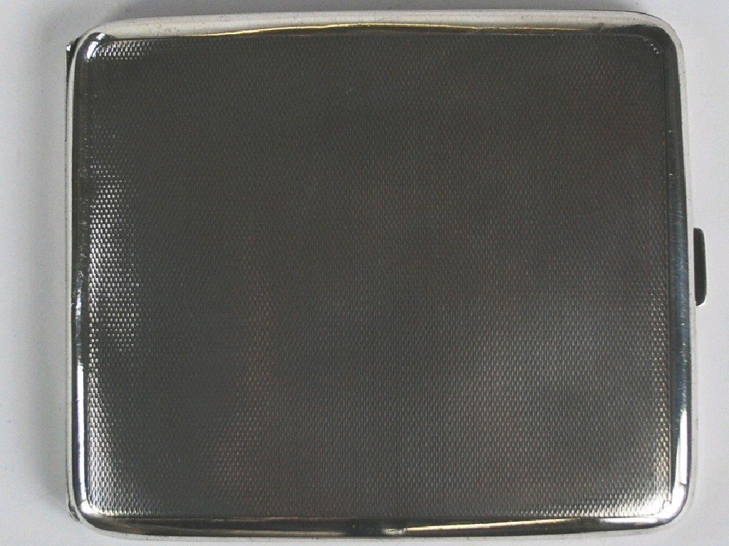 Appraisal: SILVER CURVED OBLONG POCKET CIGARETTE CASE with engine turned decoration