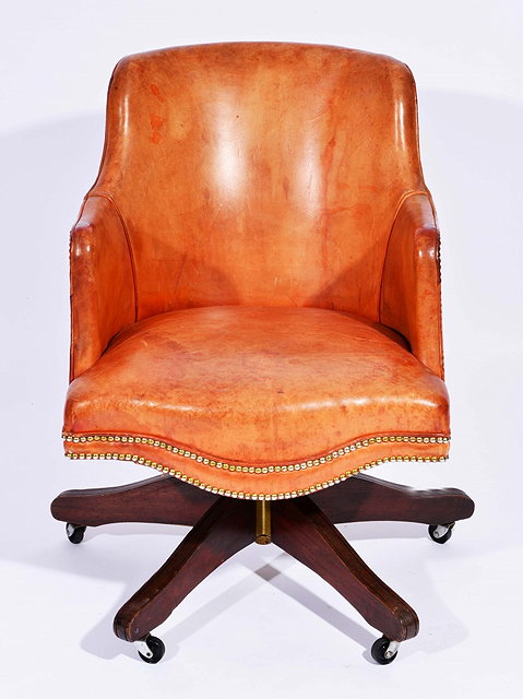 Appraisal: A NORWEGIAN TAN LEATHER SWIVEL OFFICE CHAIR on splay supports