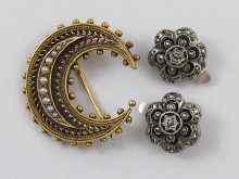 Appraisal: An antique yellow metal crescent shaped brooch tests ct gold