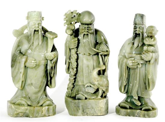 Appraisal: Chinese carved stone figures of immortals standing deities holding attributes