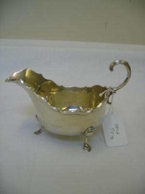 Appraisal: A SAUCE BOAT of oval form with heavily moulded rim