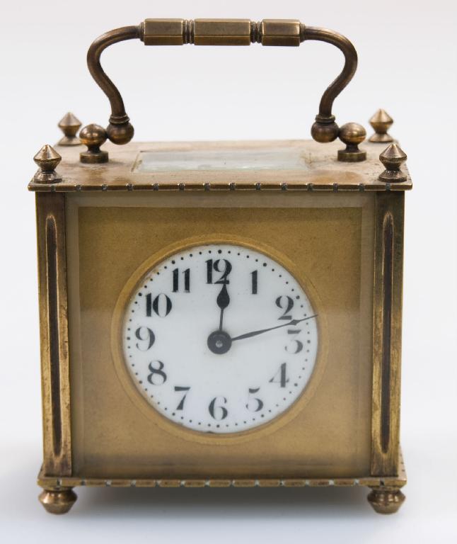 Appraisal: BRASS CARRIAGE CLOCK c of small proportions with circular enamelled