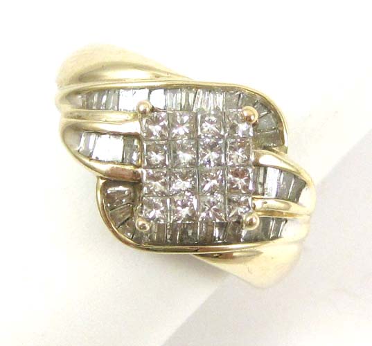 Appraisal: DIAMOND AND TEN KARAT GOLD RING with channel set baguette