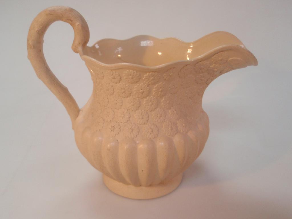 Appraisal: A Brameld Rockingham works drabware daisy jug of low baluster