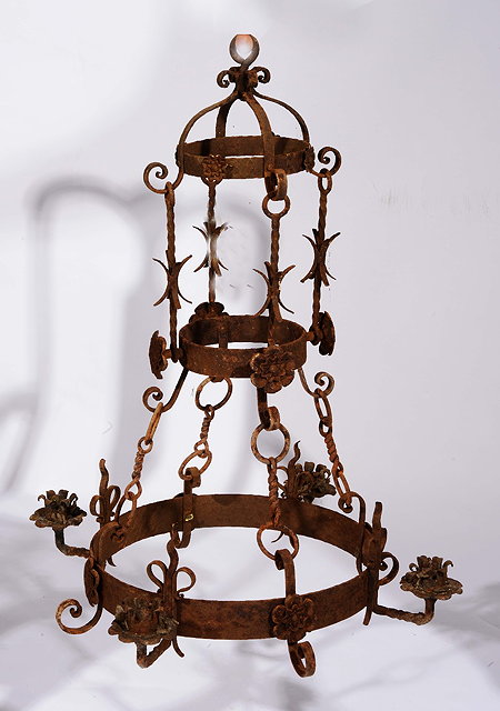 Appraisal: A wrought iron Gothic style chandelierwith four sconces cm