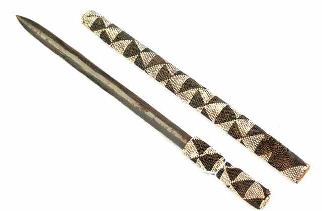 Appraisal: A TUTSI RWANDA SHORT SWORD with steel blade and bead