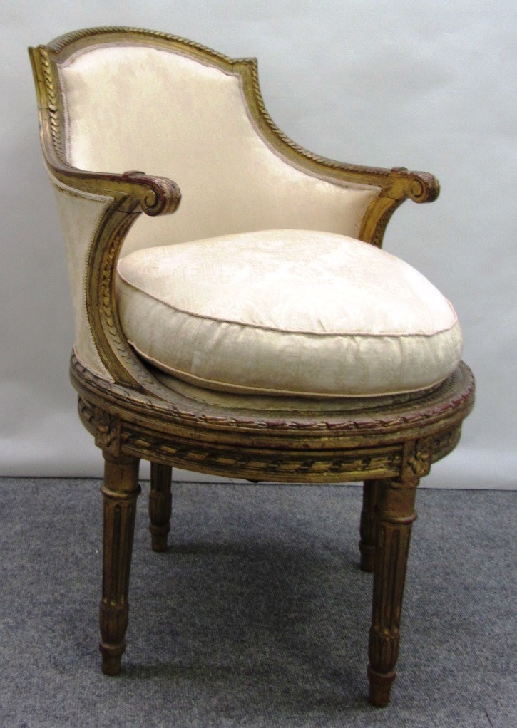 Appraisal: A Louis XVI style gilt framed tub back armchair on