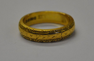 Appraisal: ct wedding band having cast decoration size L approx g