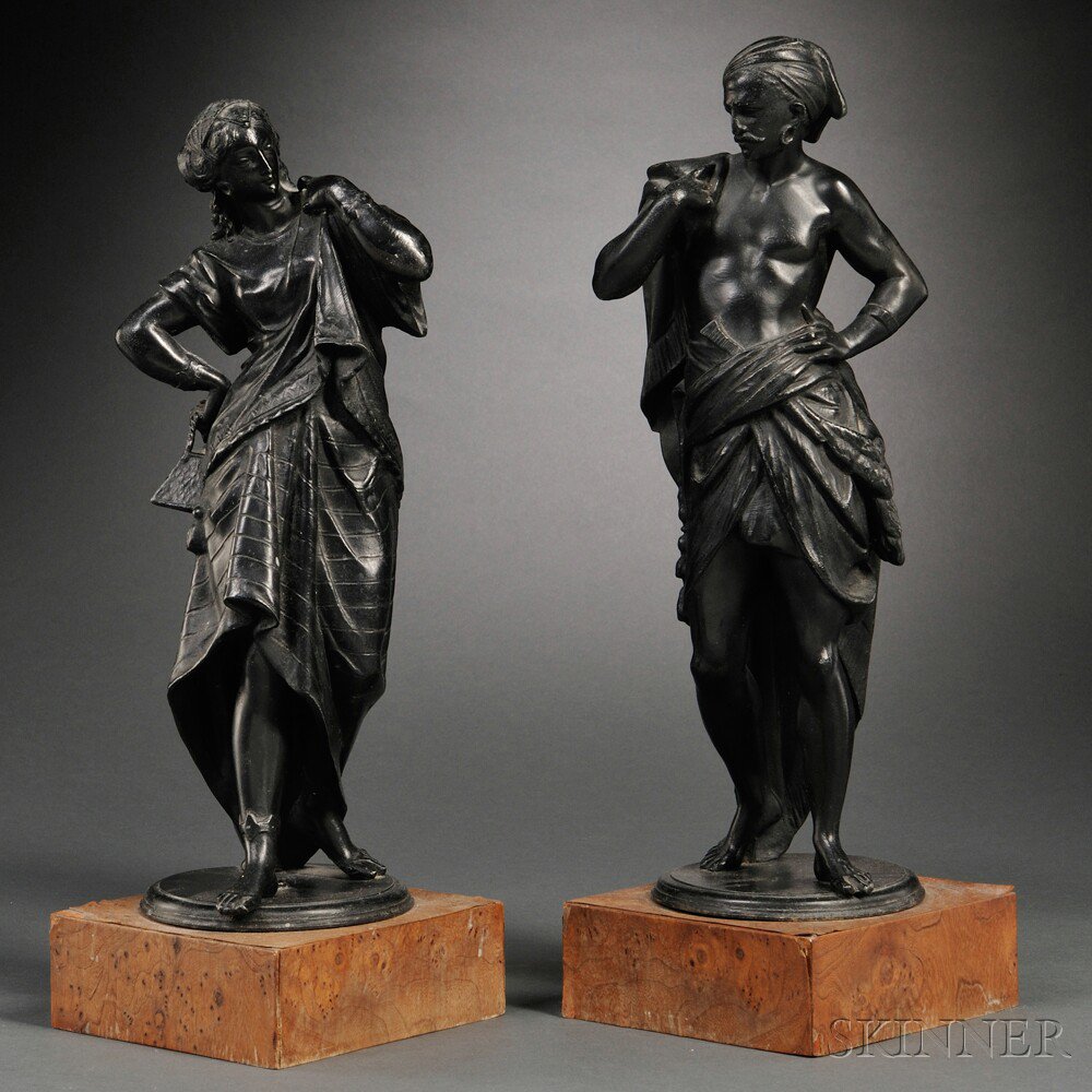 Appraisal: Pair of Patinated White Metal Figures th century on burl