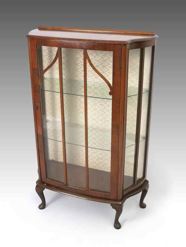 Appraisal: ENGLISH DECO CABINET WITH GLASS SHELVES Shaped cabinet with glass