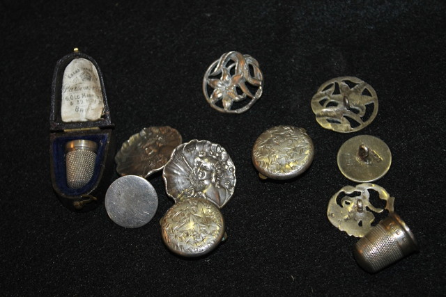 Appraisal: THREE SILVER THIMBLES together with a small collection of embossed