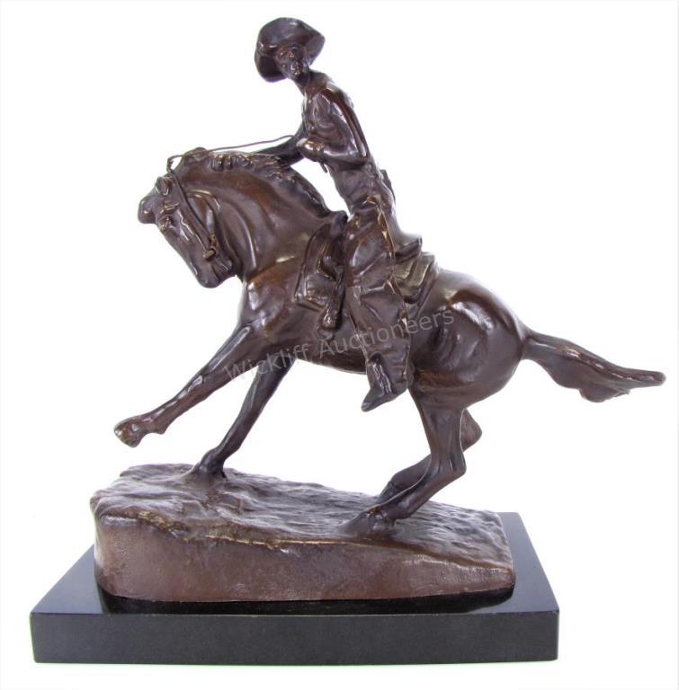 Appraisal: Cowboy after Frederic Remington American - recast bronze depicting a