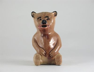 Appraisal: A Majolica bear jug with a pale brown glaze the