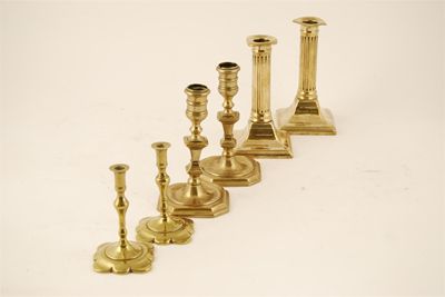 Appraisal: A pair of early th century brass candlesticks with bead