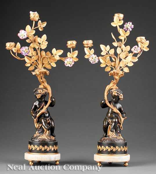 Appraisal: A Pair of French Patinated and Gilt Bronze Figural Three-Light