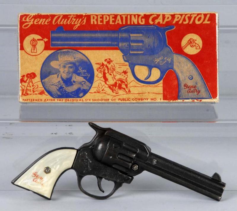 Appraisal: Cast Iron Gene Autry Cap Gun Description Includes box Toy