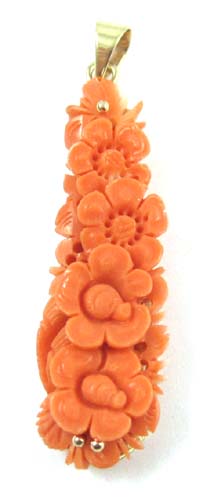 Appraisal: CORAL AND FOURTEEN KARAT GOLD PENDANT The floral carved coral