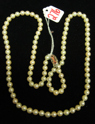 Appraisal: PEARL AND SILVER NECKLACE inch length with round white pearls