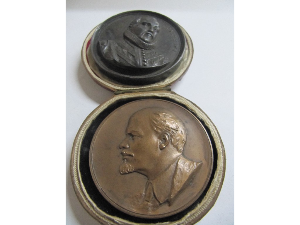 Appraisal: A Russian bronze commemorative medallion bearing Lenin's profile and a