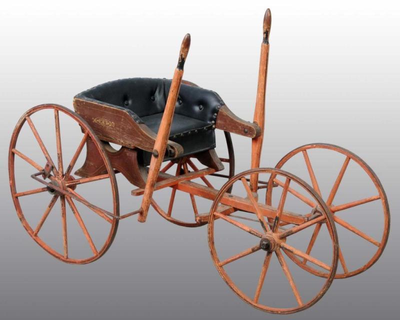 Appraisal: Wooden Primitive Child's Cart Description Has four spoked wheels and