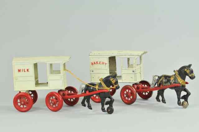 Appraisal: KENTON MILK AND BAKERY WAGON Both cast iron horse drawn