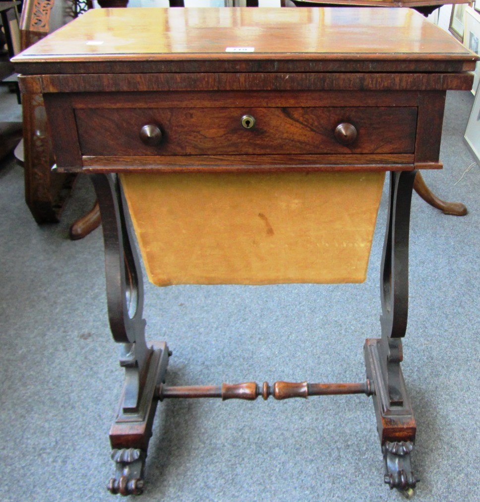 Appraisal: A Regency rosewood sewing table the foldover top over single