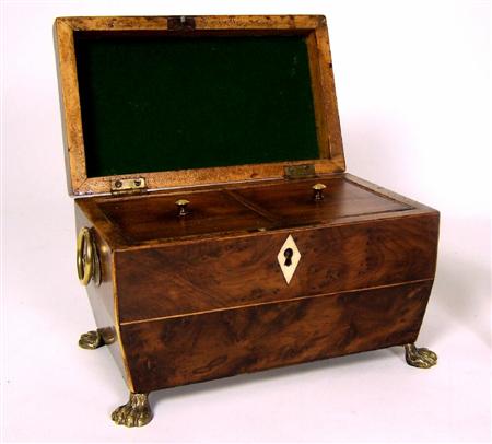 Appraisal: A Regency burr yewwood tea caddy of sarcophagus form and