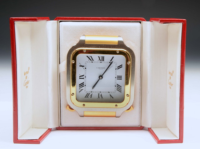 Appraisal: A CARTIER BRASS AND BRUSH STEEL ALARM CLOCK the square