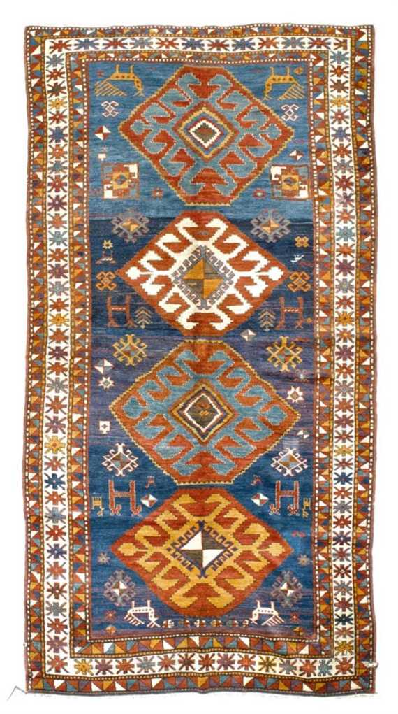 Appraisal: KARS KAZAK antique Blue central field with four medallions geometrically