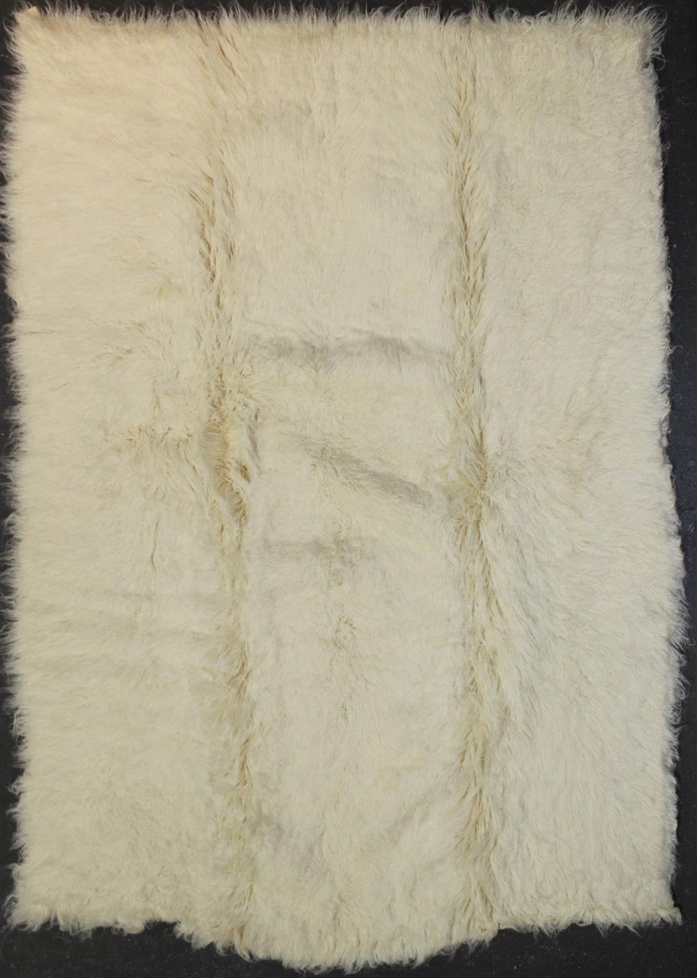 Appraisal: FLOKATI NATURAL WOOL RUG approx ' x '