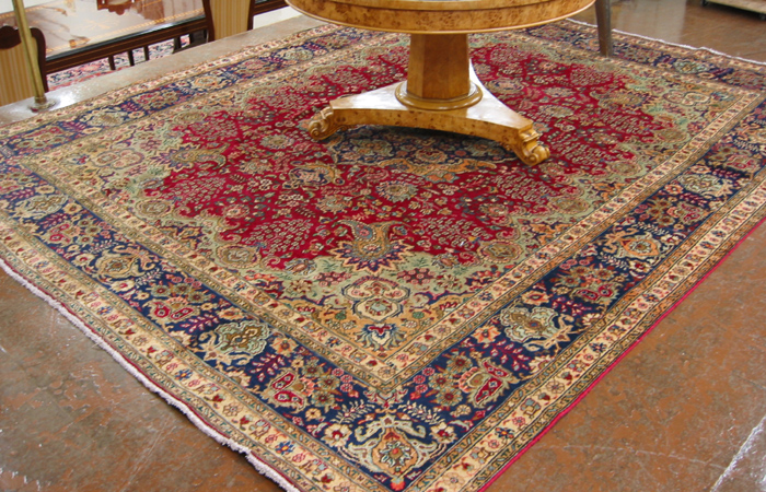 Appraisal: PERSIAN TABRIZ CARPET floral and floral medallion design on red