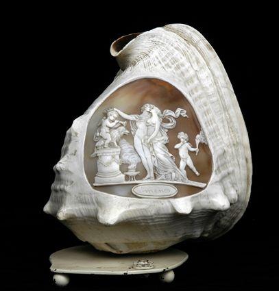 Appraisal: CONTINENTAL CAMEO-CARVED CONCH SHELL MOUNTED AS A LAMP Relief carved