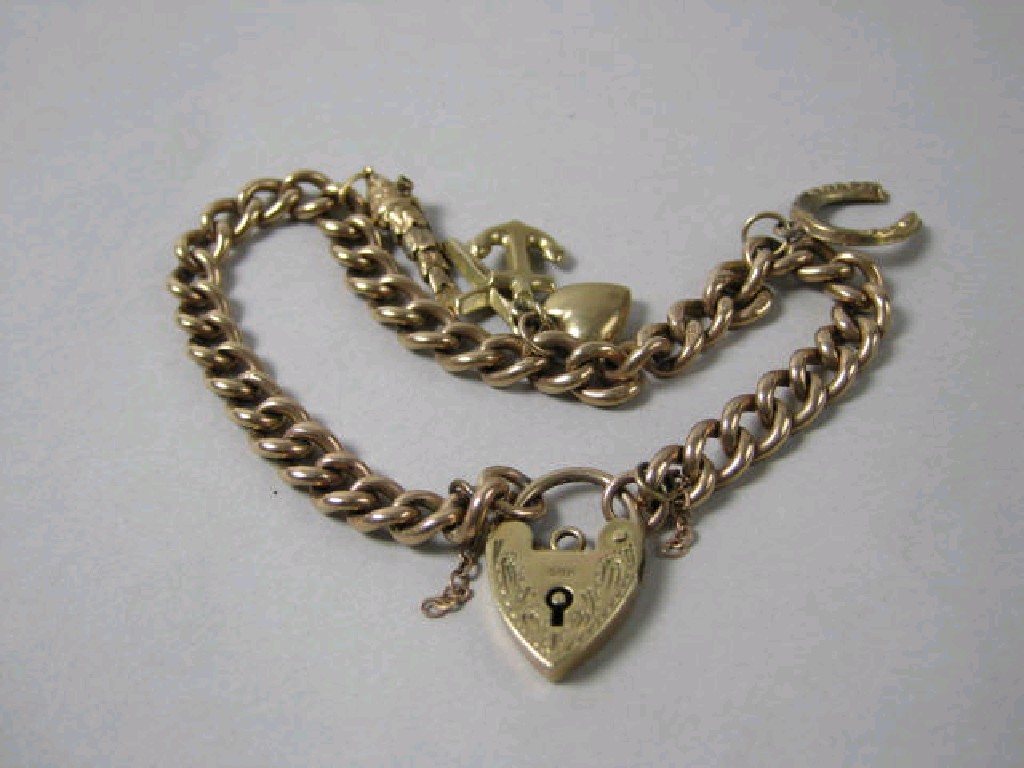 Appraisal: A ct gold curb-link Bracelet with engraved padlock fastener and