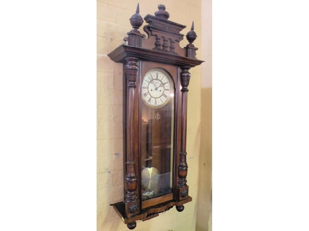 Appraisal: A Vienna wall clock the walnut case with turned finials