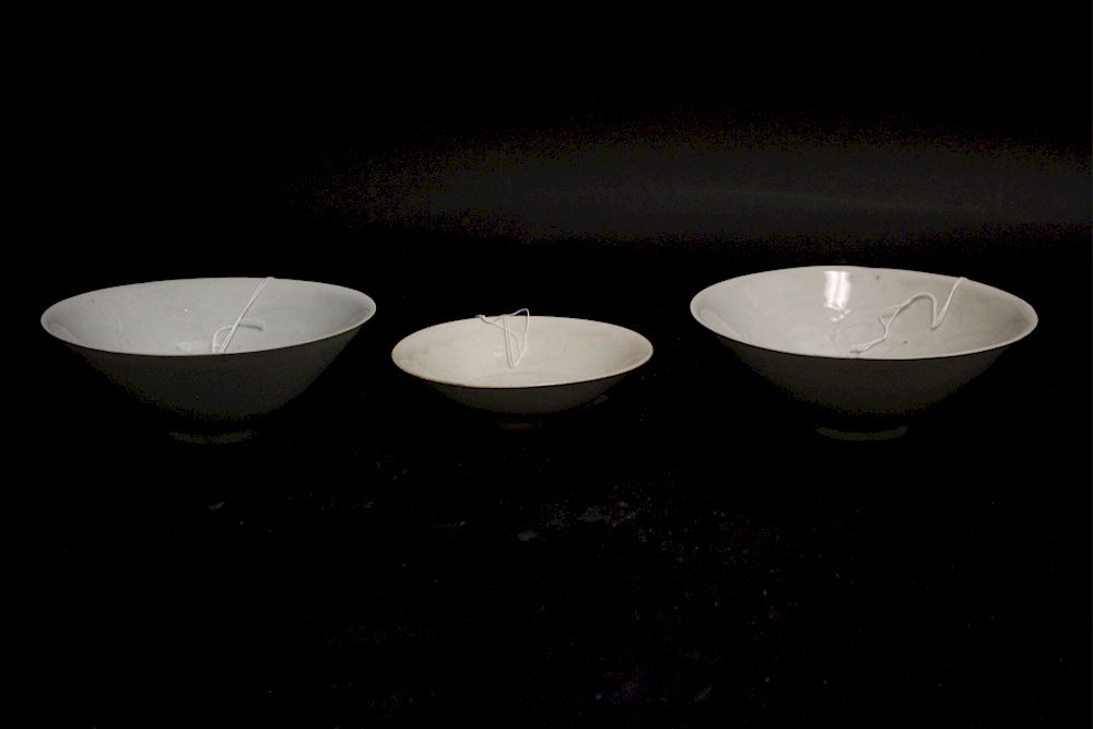 Appraisal: Three Qingbai Bowls Thinly formed bowls of the typical Qingbai