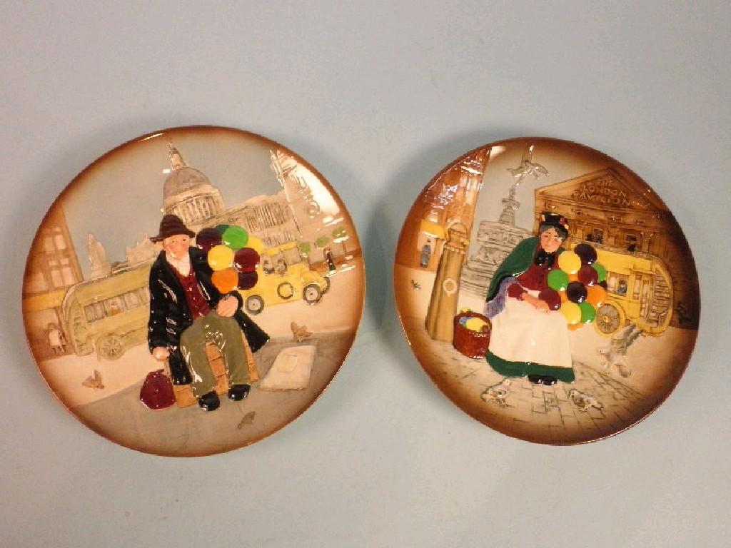 Appraisal: A pair of Royal Doulton plates decorated in relief with