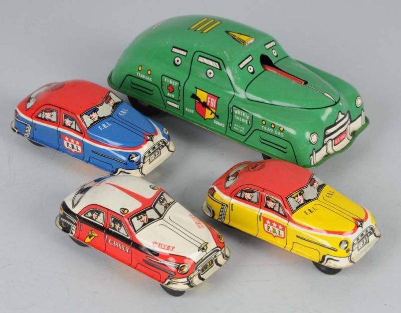 Appraisal: Lot of Tin FBI Car Toys Description American The larger