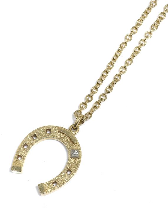 Appraisal: A GOLD AND DIAMOND PENDANT ON A CHAIN circa Yellow