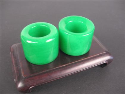 Appraisal: Pair of Chinese green jade archer's rings Qing dynasty Identically