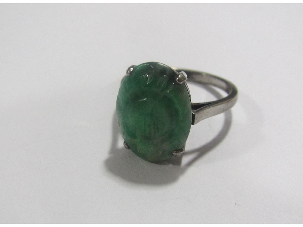 Appraisal: White metal carved jade single stone ring