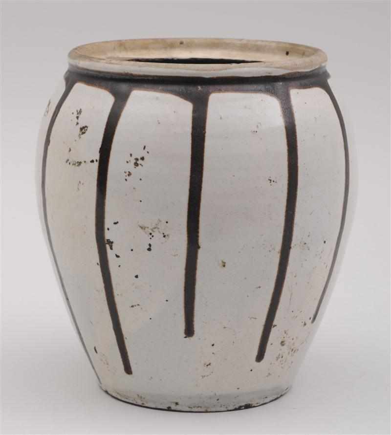 Appraisal: JAPANESE DRIP-GLAZED POTTERY JAR The ovoid white-ground bowl with molded