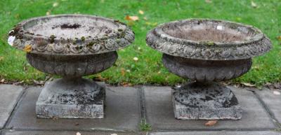 Appraisal: A pair of squat reconstituted stone vases with reeded bodies